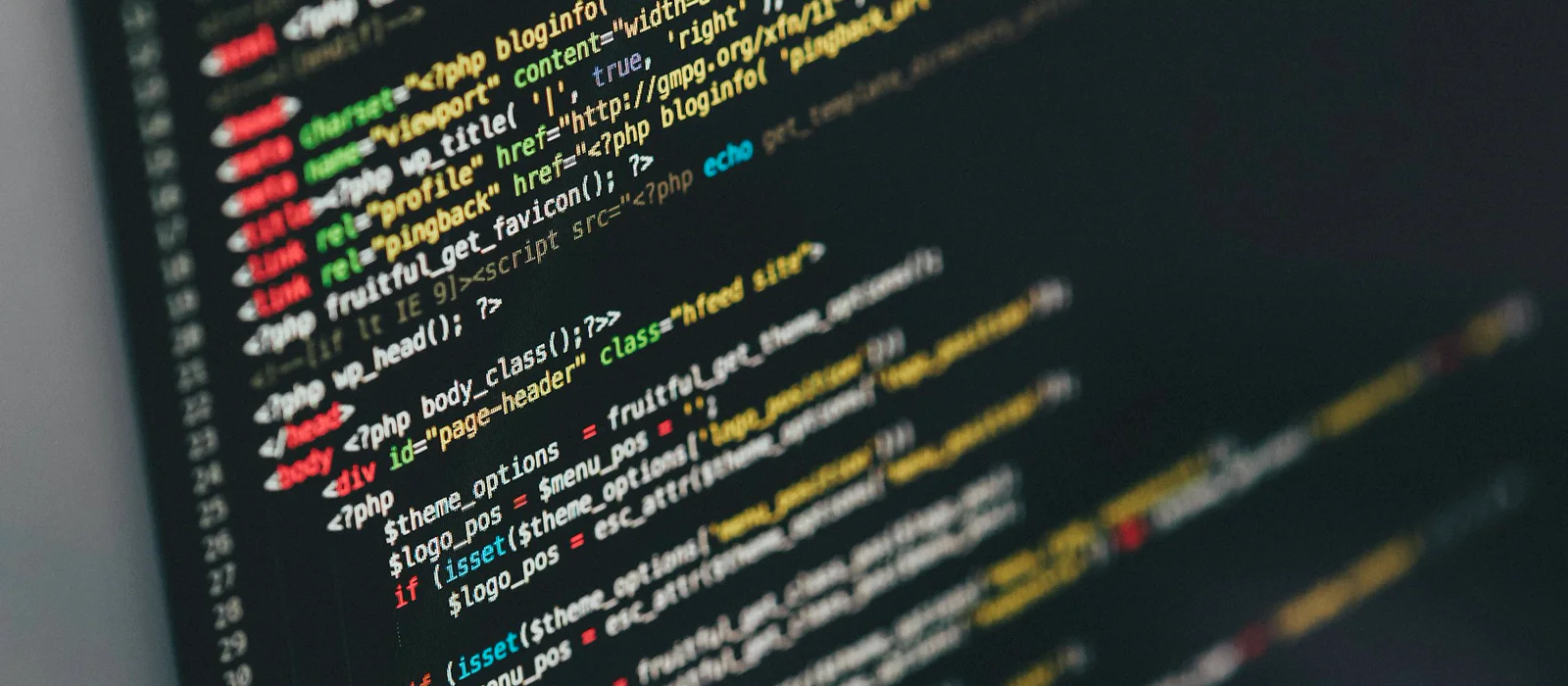 Business owner beside website and software artwork